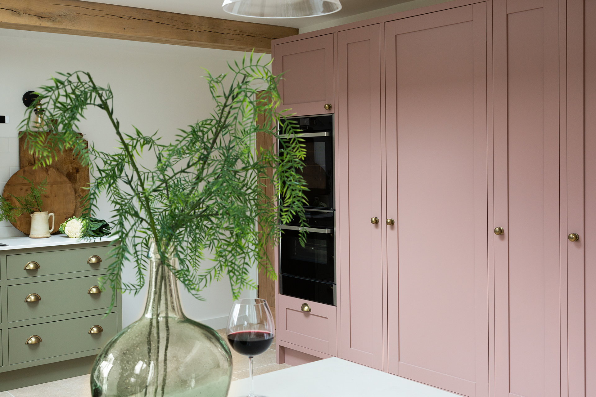In frame pink and green kitchen